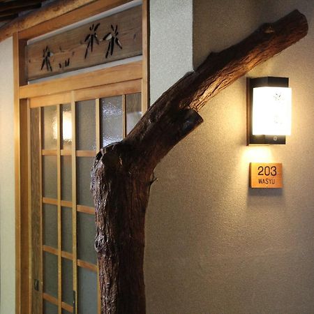 Hotel Tomada Onsen Iyashi No Yado Sensui Okayama Exterior foto